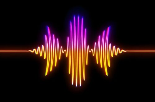 Glowing multicolored audio waveform on a black background