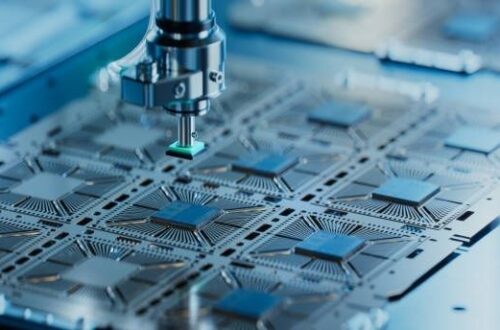 Microscope probe positioned over patterned microchip circuits