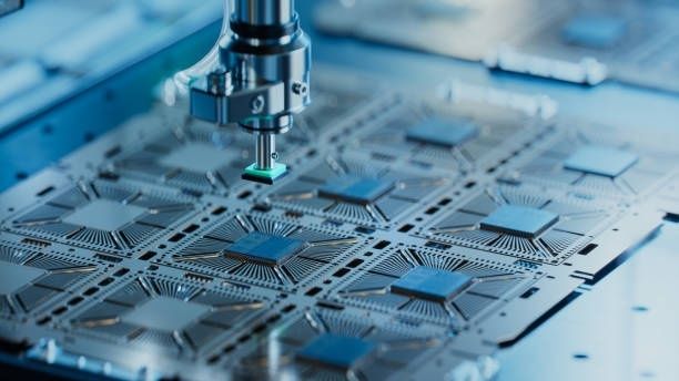 Microscope probe positioned over patterned microchip circuits